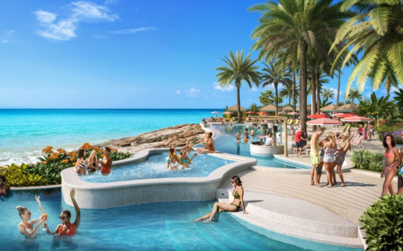 An image depicting what the new Royal Carribean beach club will look like, with a swimming pool and people relaxing.