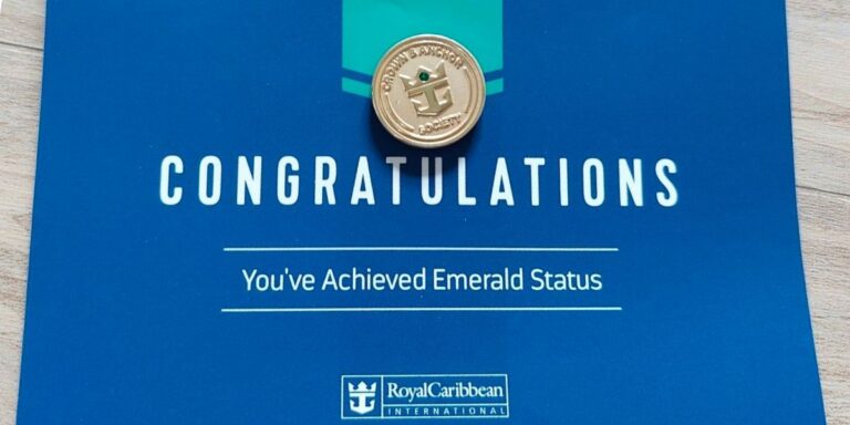 Congratulatory blue card for achieving Royal Caribbean Emerald Status