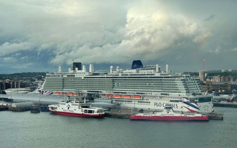 A ferry and cruise ship doing their different purposes