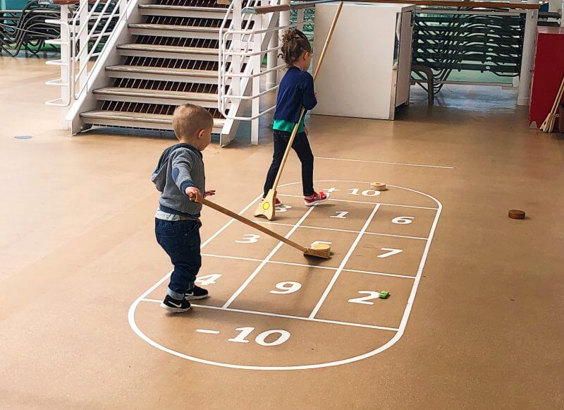 Kids playing shuffleboard on Britannia