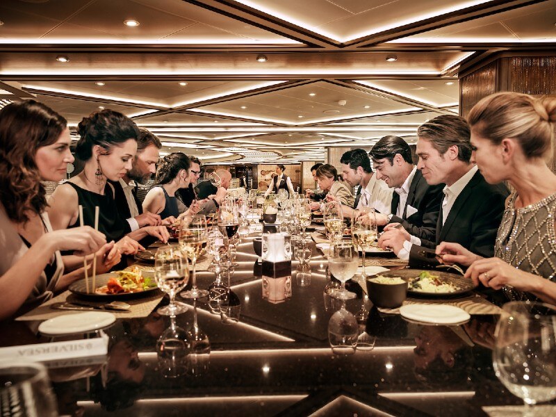 A large table of solo travellers on a Silversea cruise