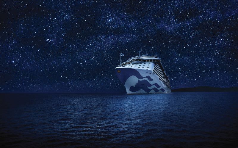 Sky Princess under a starry night while sailing the ocean.