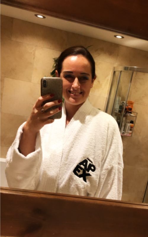 Cruise mummy taking a selfie wearing a cruise ship bath robe