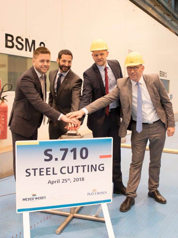 Men smiling during P&O Cruises steel cutting ceremony