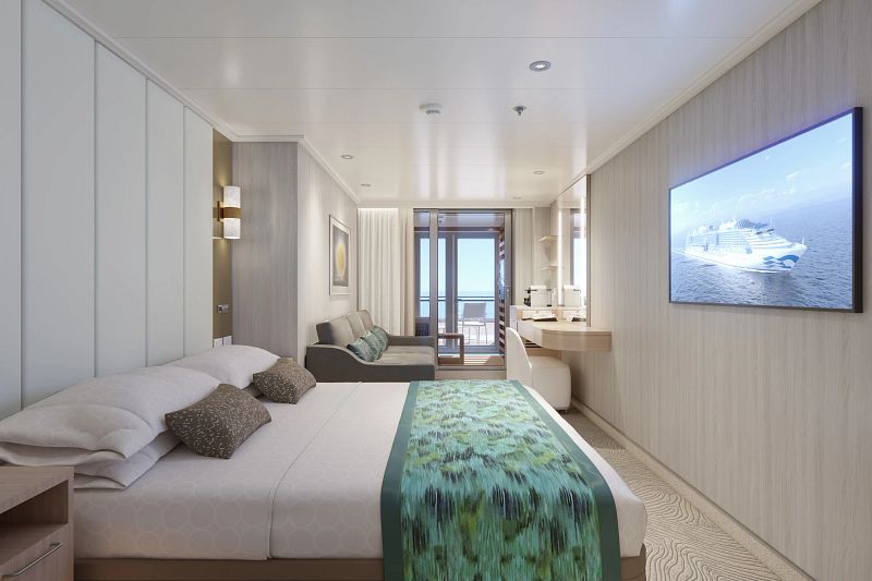 Interior view of a Cabana Mini-Suite on the Sun Princess cruise ship, showing a well-appointed room with a plush bed, sofa seating area, and a large screen displaying an image of the ship, leading to a private balcony with ocean views.