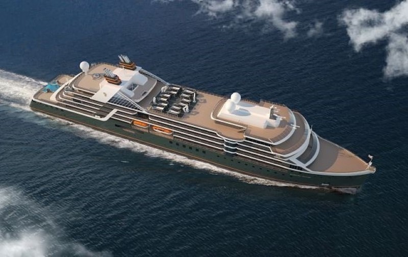 Aerial view of the Seabourn Venture expedition ship, showcasing its unique brown and white color scheme, multiple decks, and advanced navigational equipment as it navigates through the ocean with scattered clouds overhead.