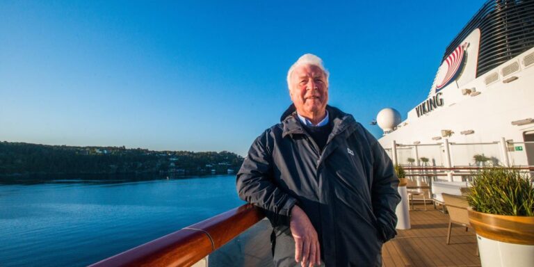 a man standing on a cruise ship deck