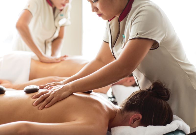 Two women being massaged on NCL cruise ship