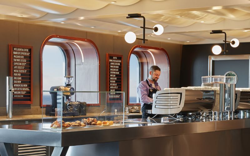 Barista making a coffee on Virgin Voyages Grounds Club