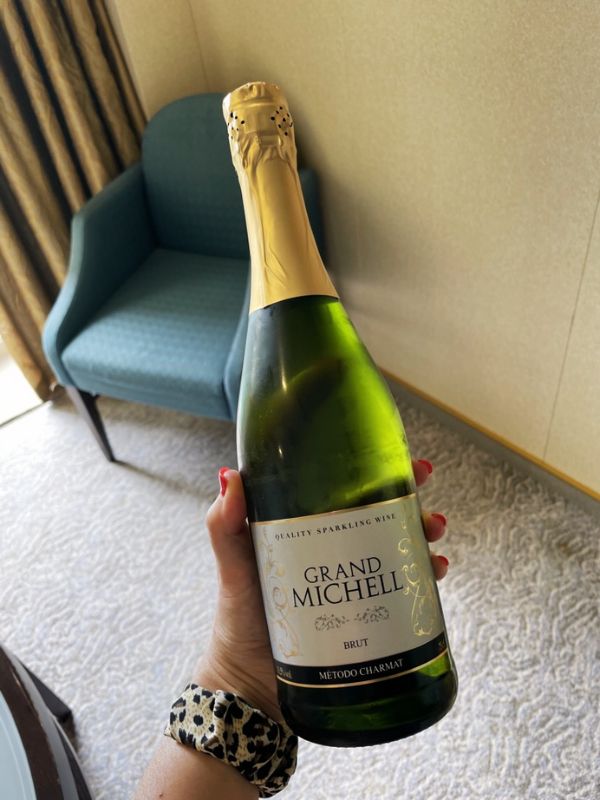 a bottle of sparking wine in a cruise cabin