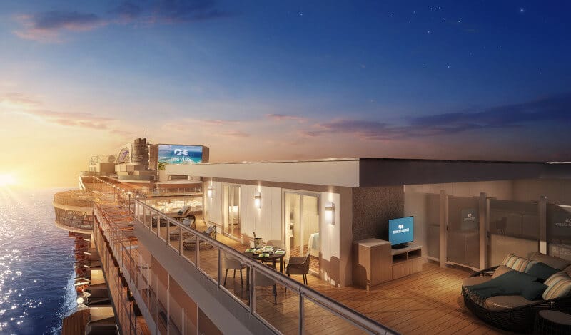 The luxurious Sky Suite balcony on a Princess cruise ship at dusk, featuring a cozy outdoor lounging area, elegant dining setup, and an inviting interior seen through glass doors, all basked in the warm glow of the setting sun.