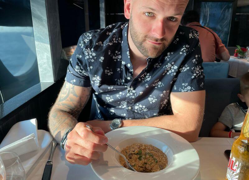 a man eating on an MSC cruise ship