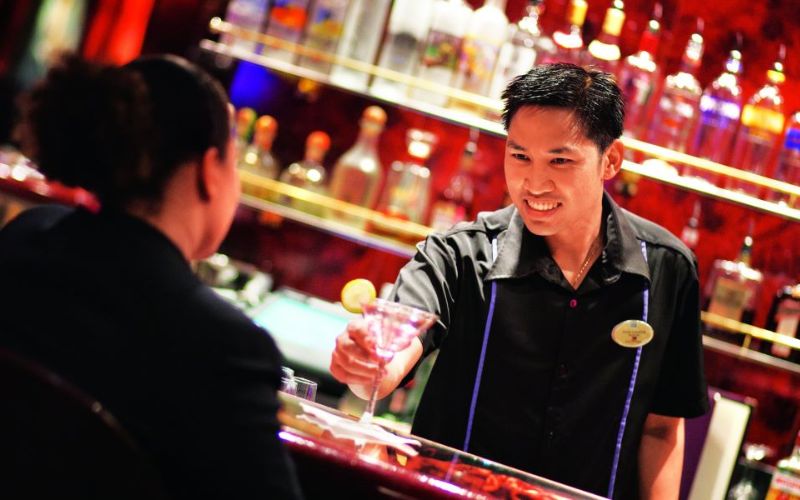 Bartender handing out  a drink