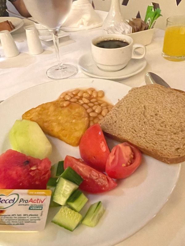 Breakfast bread, beans and veggies served with coffee and juice