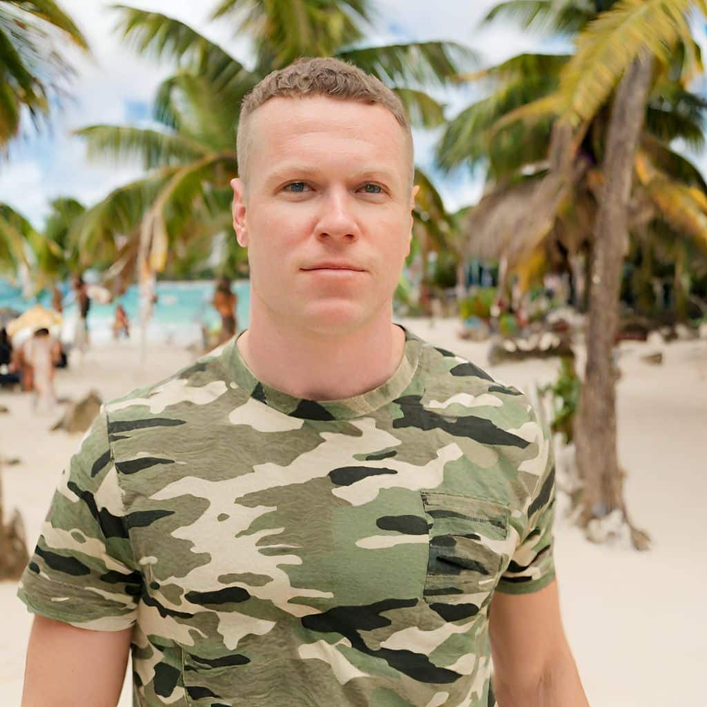 A person wearing a camo tshirt in the Caribbean