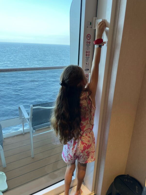 Child opening balcony on MSC Virtuosa