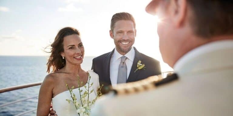 two lovely couple wearing a big smile while being married at a cruise ship