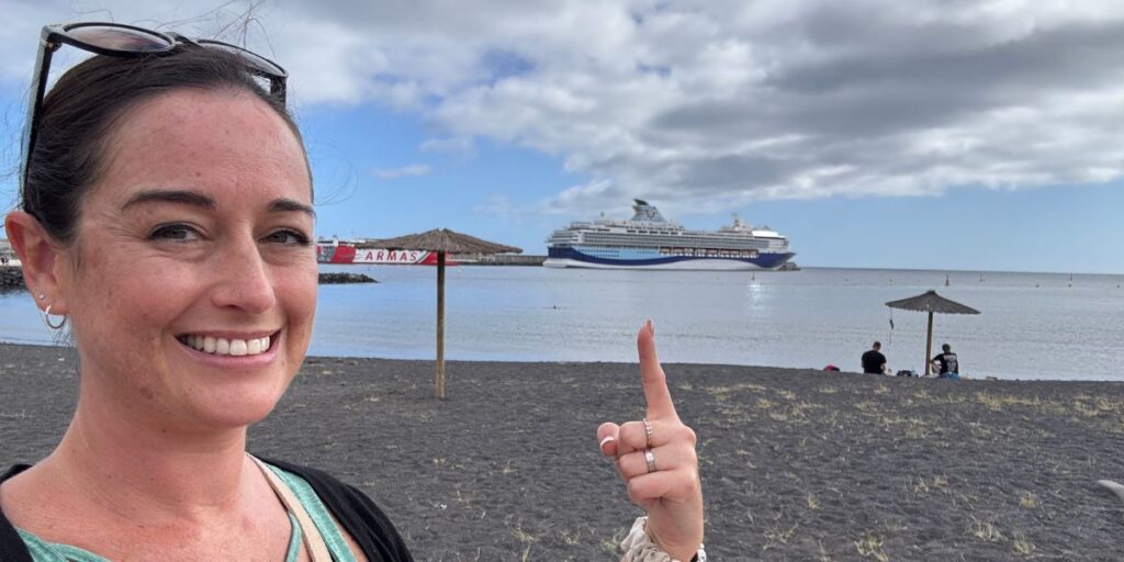 Jenni Cruise Mummy pointing at a Marella Cruises ship