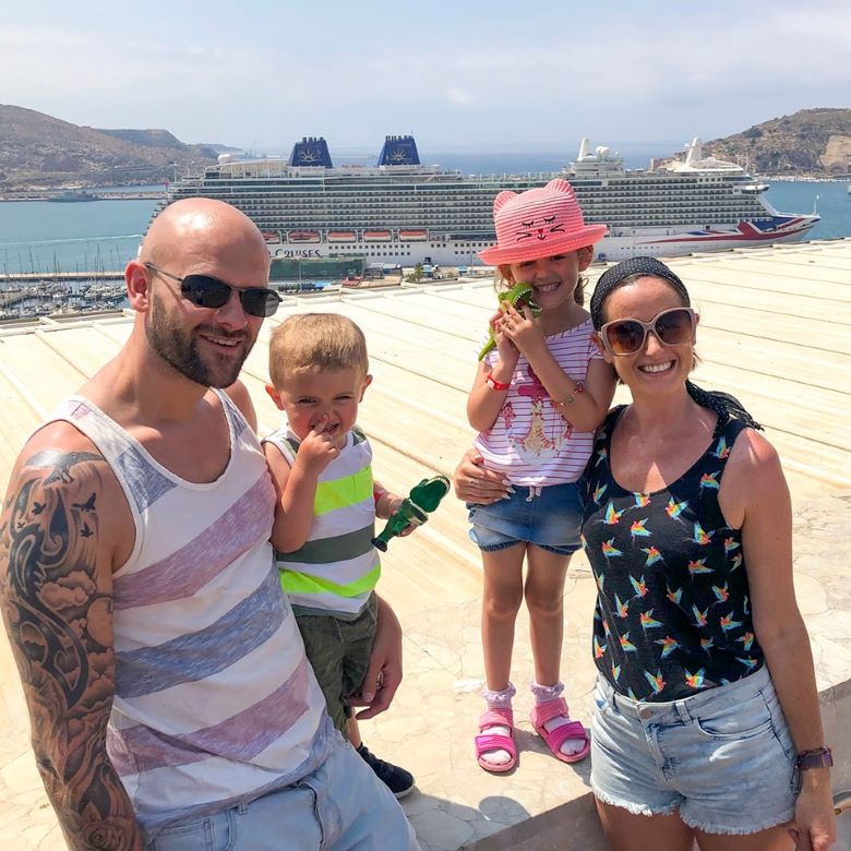 Family with cruise ship in Barcelona