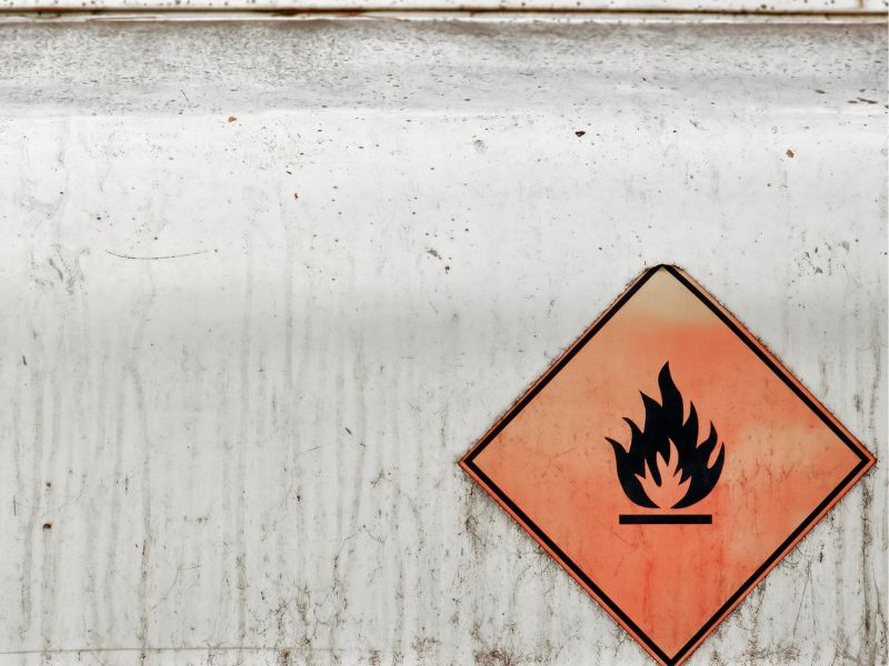 A fire hazard sign at a gas tank