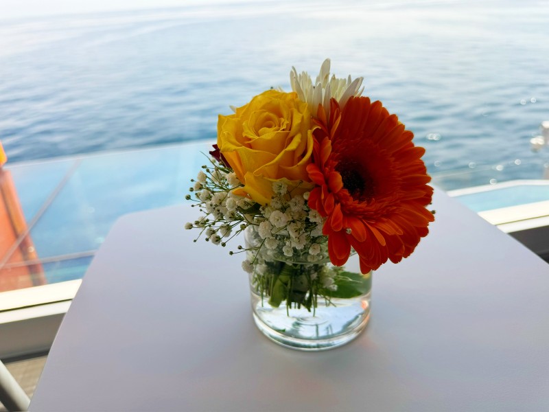 a bunch of flowers on board CelebritY Apex