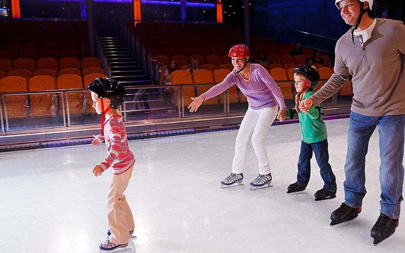 family on ice skating rink