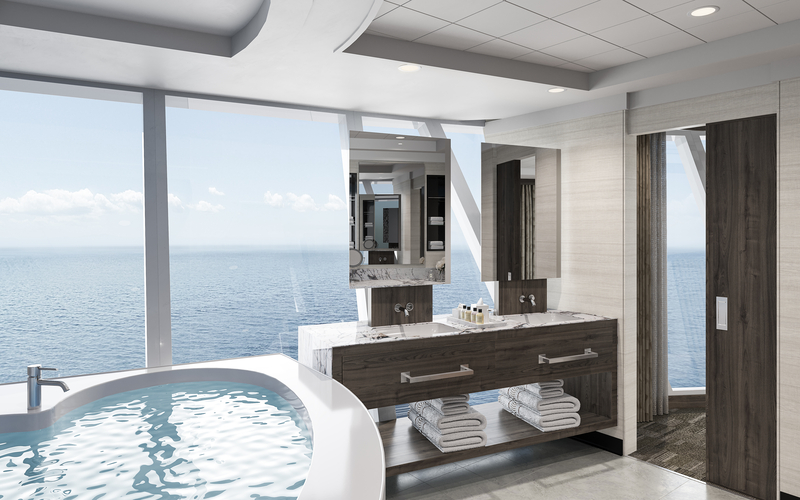 Modern NCL haven bathroom featuring a large soaking tub with ocean view, marble vanity with dual sinks, and plush towels, blending luxury and nautical charm.