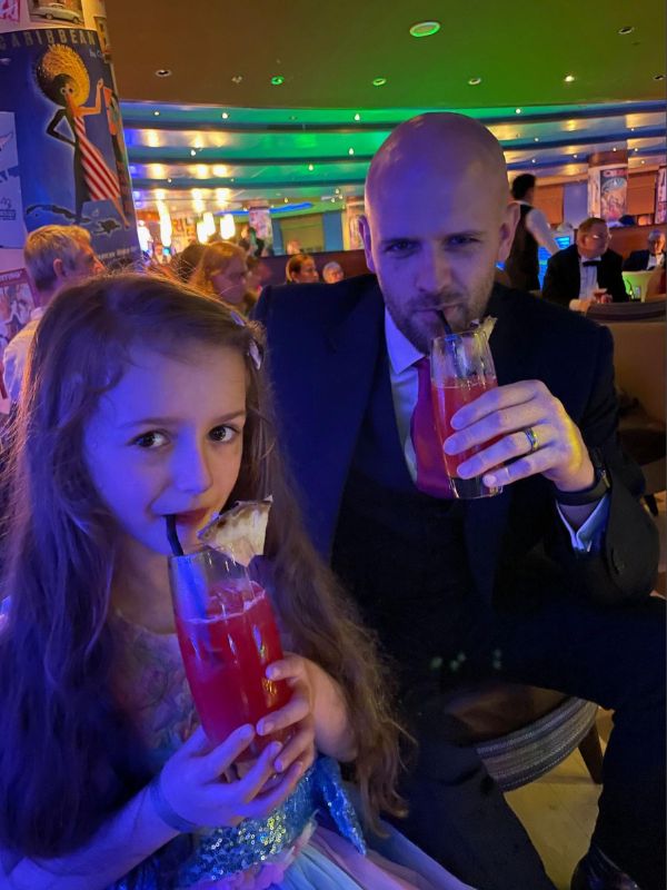 Father and daughter enjoying their drinks together