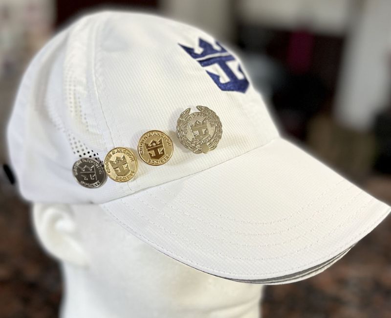 A hat with different lapel pins