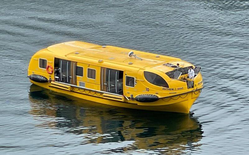 yellow Anthem of the Seas lifeboat being tested during a cruise in Norway