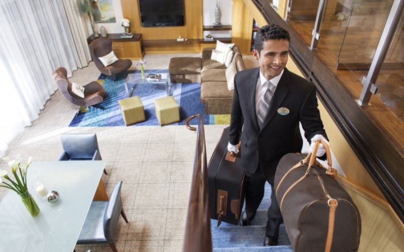 man carrying a suitcase
