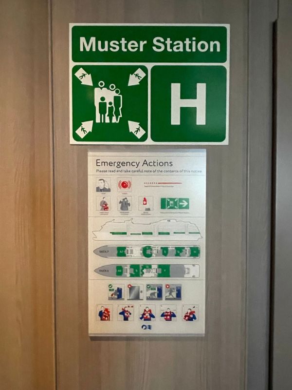 muster station sign on a cruise ship