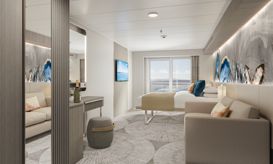 A luxurious Club Balcony Suite on the Norwegian Prima, with contemporary decor, a plush bed, comfortable seating area, and floor-to-ceiling windows leading to a private balcony with a serene sea view.