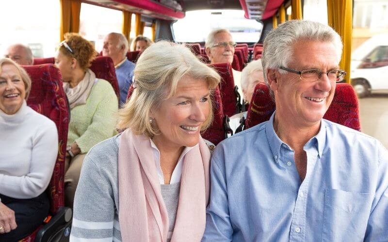Cruise passengers inside a coach.