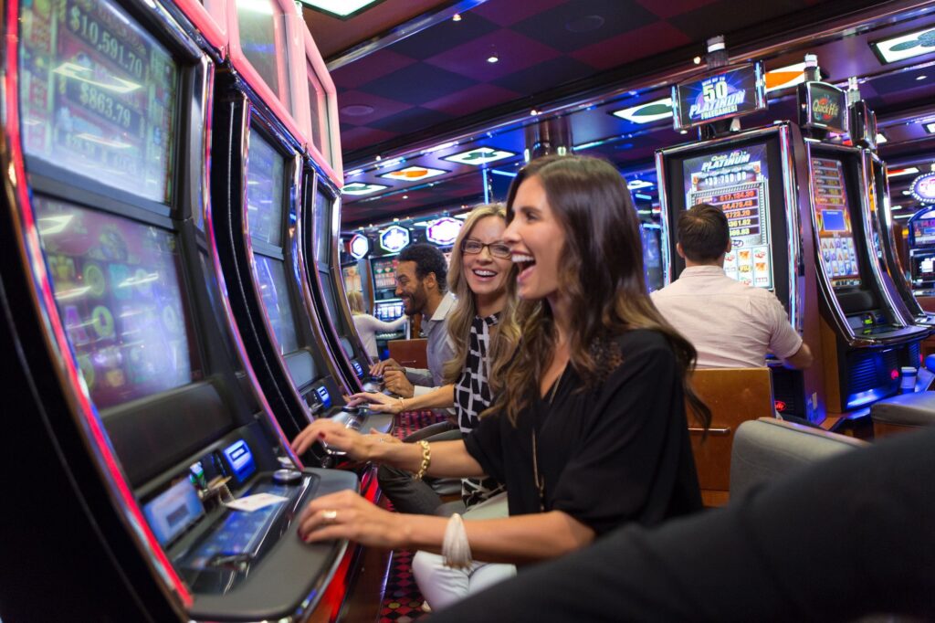 Two ladies having fun while playing in the Casino Royale