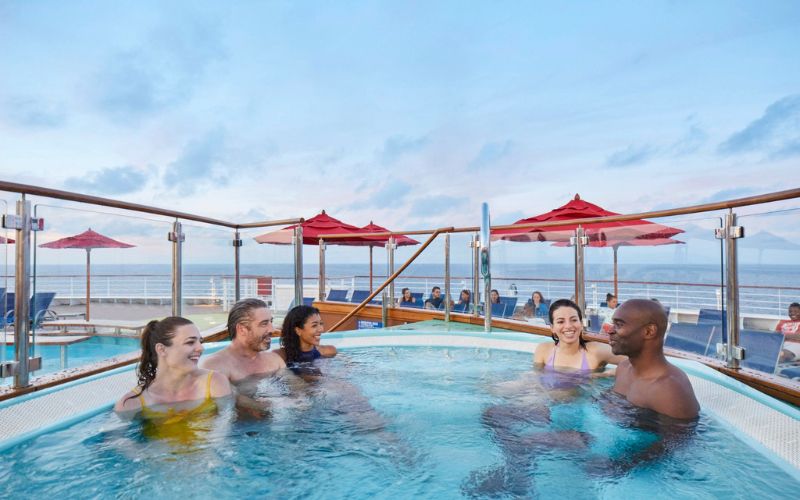 Friends relaxing on a Carnival cruise ship's pool area