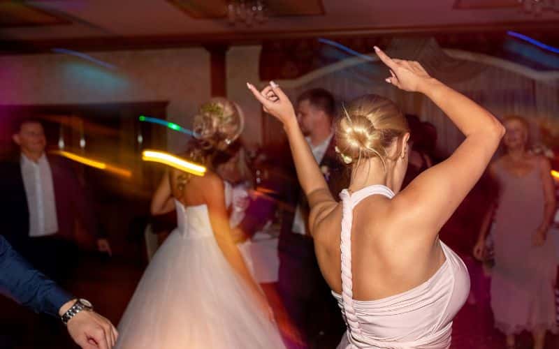 Wedding bride and guests partying after the ceremony at a private venue