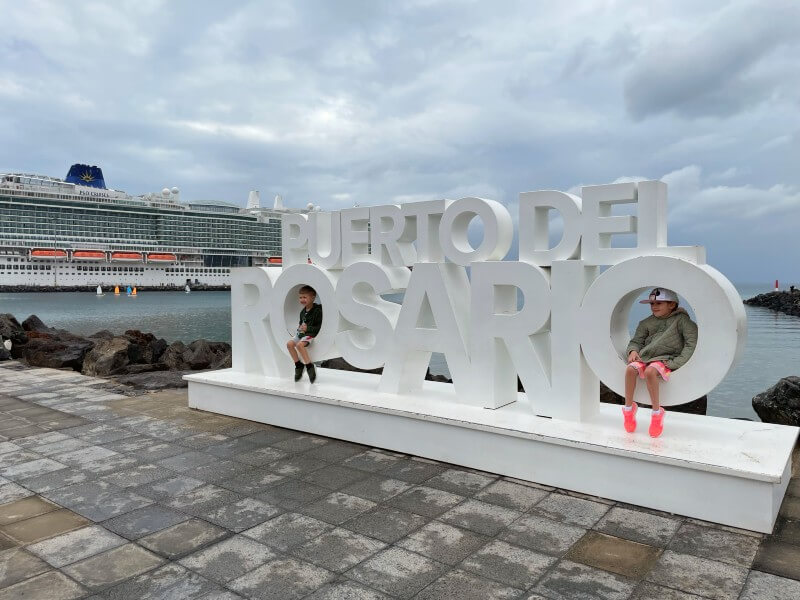 Children taking pictures at the port