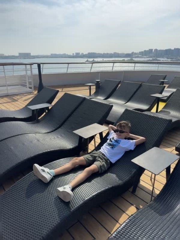 A smaller cruise ship with plenty of sun loungers