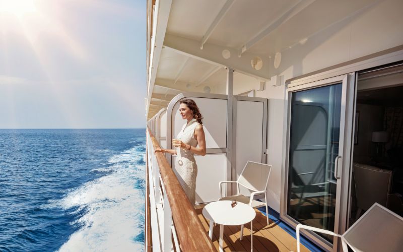 Woman in suite veranda on Silversea cruise ship