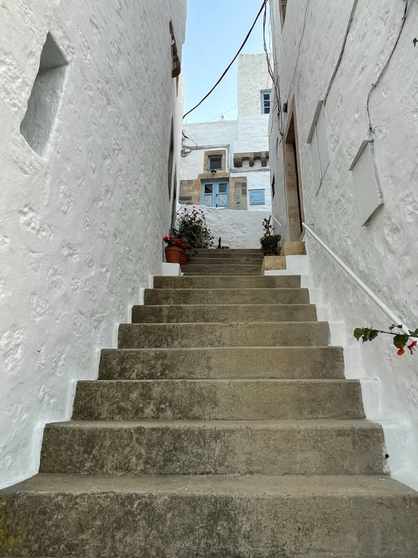 small stairs in between white walls