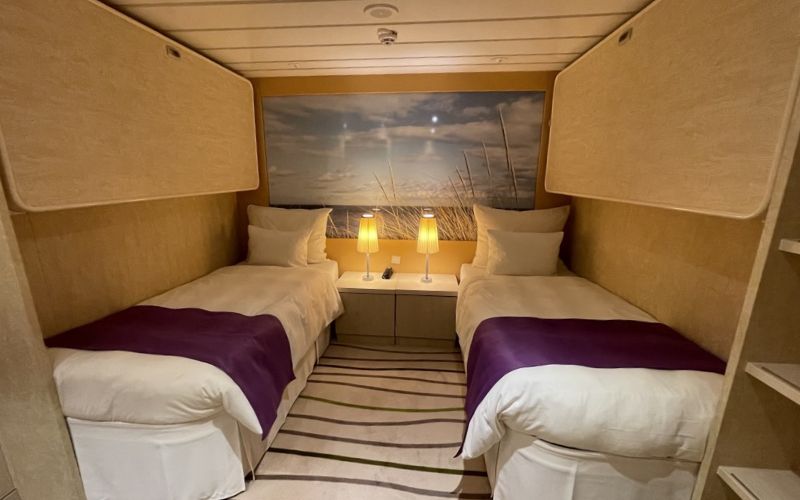 Inside a two-bed cabin of a cruise ship