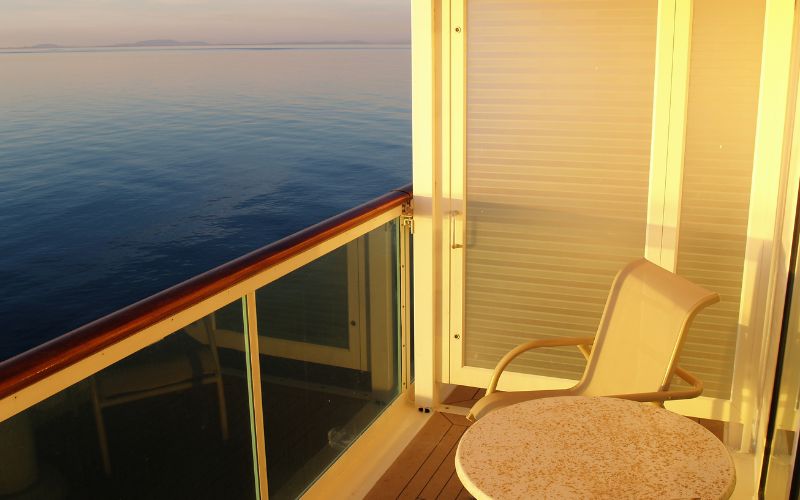 cruise ship balcony with sunset at dusk