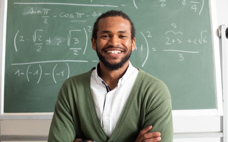 A teacher smiling