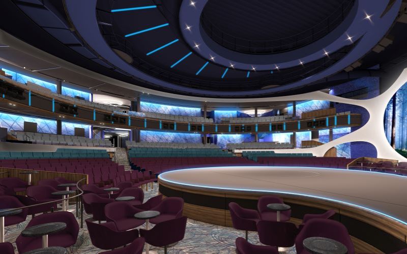 The modern interior of a theater on a Celebrity cruise ship, featuring plush purple seating, a spacious circular stage, and ambient lighting. The design is complemented by a large, abstract forest mural, creating an immersive entertainment environment.