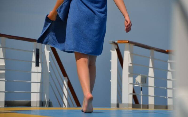 Woman wearing cruise pool towel
